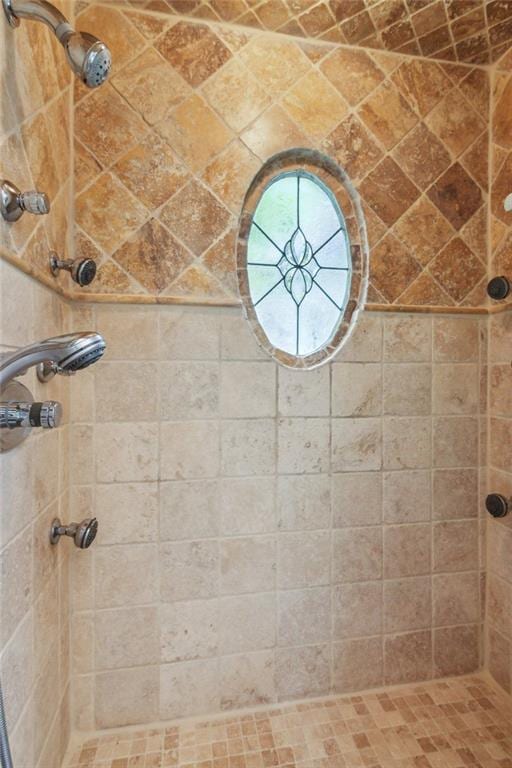 bathroom with a tile shower