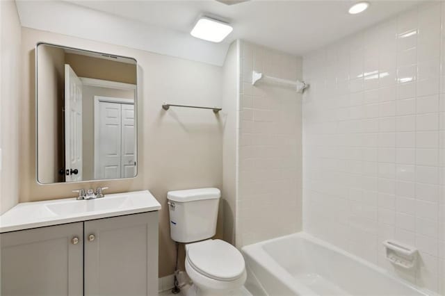 bathroom with toilet, shower / tub combination, vanity, and recessed lighting