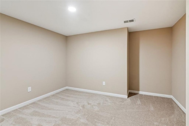 unfurnished room featuring light carpet, baseboards, and recessed lighting