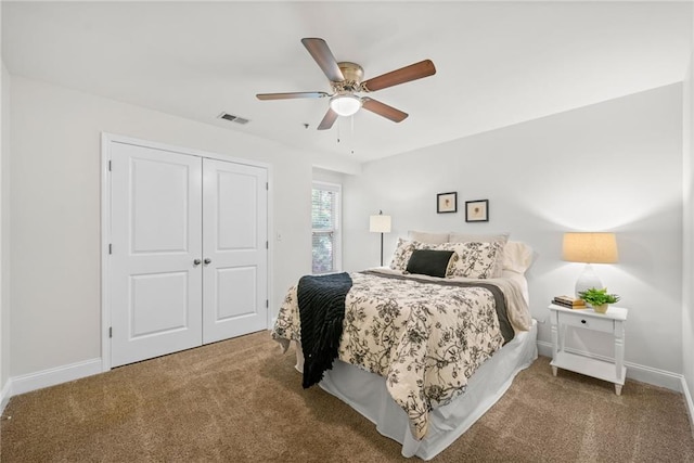 carpeted bedroom featuring a ceiling fan, baseboards, visible vents, and a closet