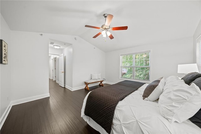 bedroom with dark wood-style flooring, ceiling fan, baseboards, and vaulted ceiling