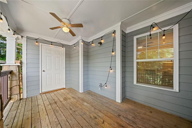 wooden deck featuring a porch and ceiling fan