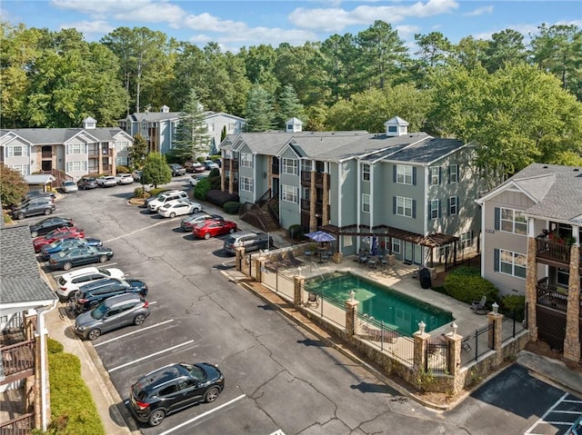 birds eye view of property with a residential view