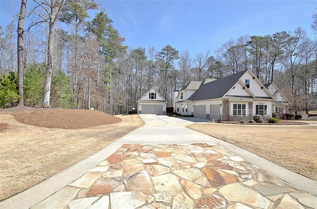 view of side of home featuring concrete driveway