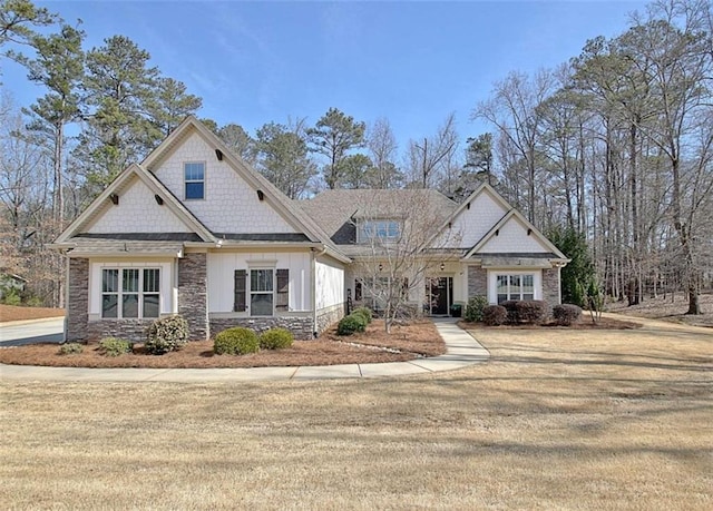 craftsman inspired home featuring board and batten siding and stone siding