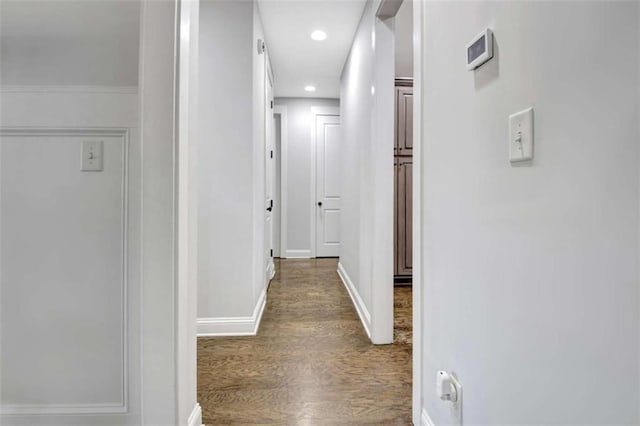 hall with recessed lighting, baseboards, and wood finished floors