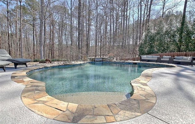 view of swimming pool with a fenced in pool, a patio, and outdoor lounge area