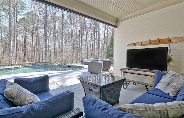 view of patio / terrace with an outdoor living space and an outdoor pool