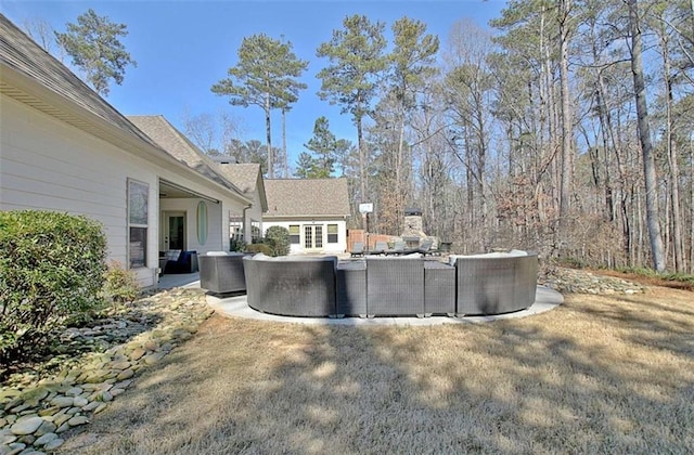 view of yard featuring an outdoor hangout area, central air condition unit, and a patio area