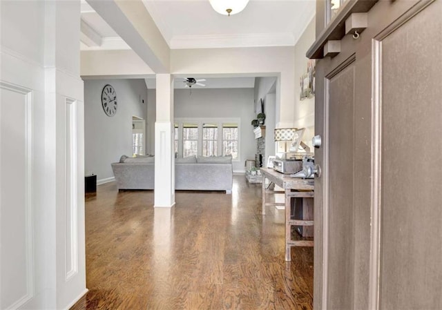 entryway with baseboards, a ceiling fan, dark wood finished floors, and ornamental molding