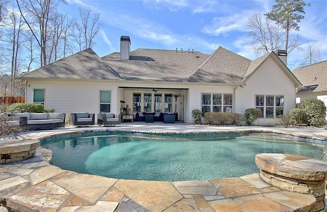 pool featuring a patio, outdoor lounge area, and a ceiling fan