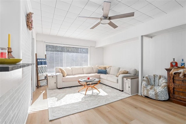 living area featuring ceiling fan and light wood-type flooring