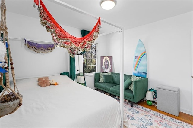 bedroom featuring wood finished floors