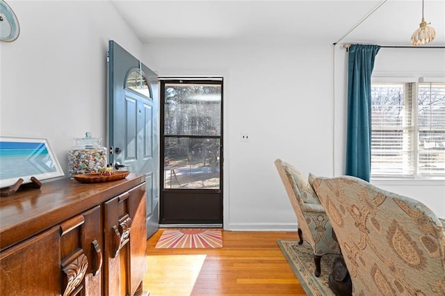 interior space with light wood-style flooring and baseboards