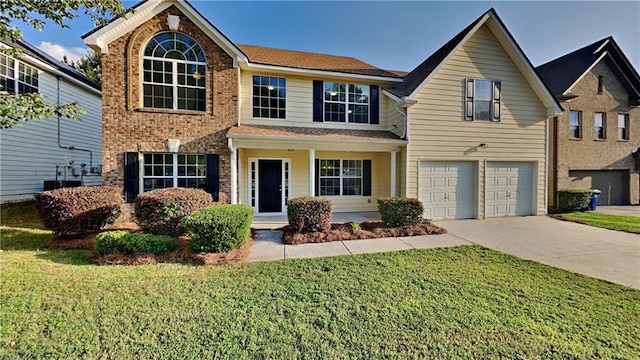 514 Jadetree Ln, Atlanta, GA 30349 - traditional-style house featuring driveway, a garage, and a front lawn