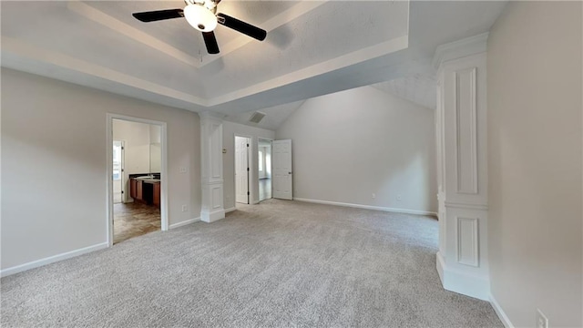 514 Jadetree Ln, Atlanta, GA 30349 - unfurnished bedroom with a tray ceiling, light colored carpet, ornate columns, baseboards, and ensuite bath