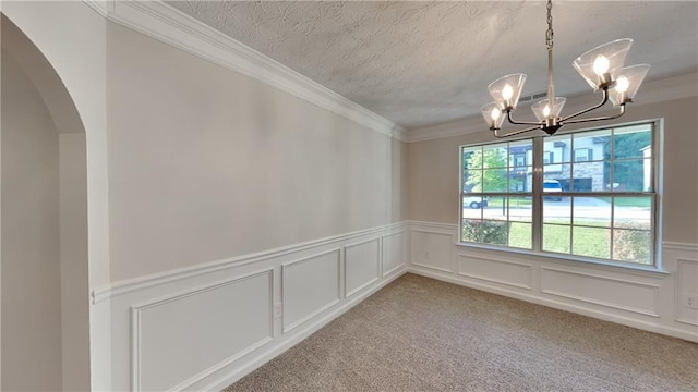 514 Jadetree Ln, Atlanta, GA 30349 - unfurnished room with a chandelier, ornamental molding, arched walkways, wainscoting, and a decorative wall