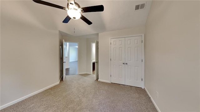 514 Jadetree Ln, Atlanta, GA 30349 - unfurnished bedroom with carpet, baseboards, a closet, and ceiling fan