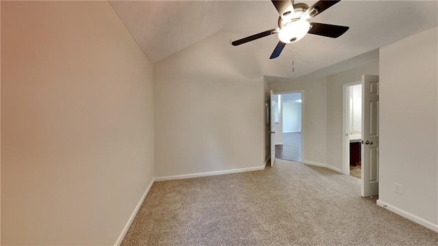 514 Jadetree Ln, Atlanta, GA 30349 - spare room featuring light colored carpet, lofted ceiling, baseboards, and a ceiling fan