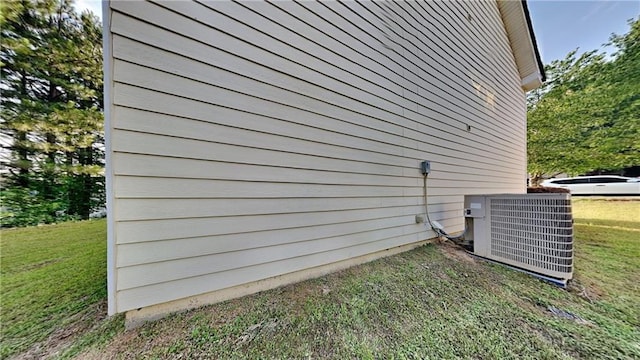 514 Jadetree Ln, Atlanta, GA 30349 - view of home's exterior featuring central air condition unit and a yard