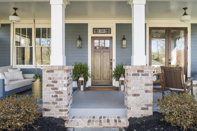 doorway to property with a porch