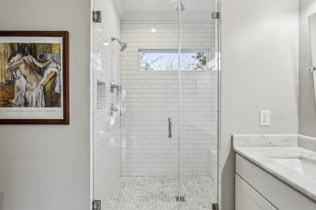 bathroom with a stall shower and vanity