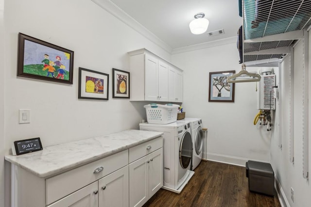 laundry room with dark wood finished floors, cabinet space, separate washer and dryer, crown molding, and baseboards