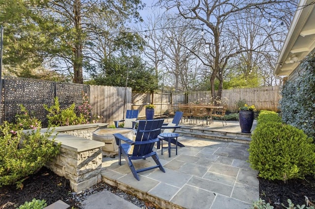 view of patio / terrace featuring outdoor dining space and a fenced backyard