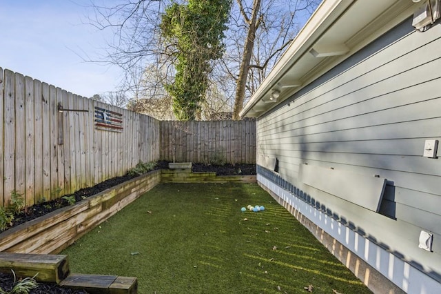 view of yard featuring a fenced backyard