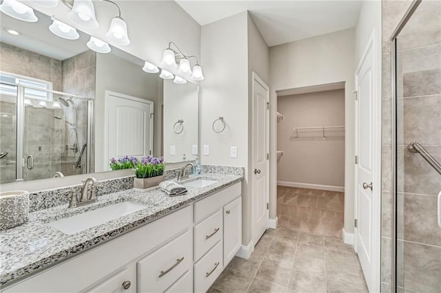 242 Aspen Way, Dallas, GA 30157 - bathroom featuring a stall shower, double vanity, and a walk in closet