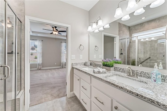242 Aspen Way, Dallas, GA 30157 - bathroom featuring double vanity, tile patterned flooring, a stall shower, and a ceiling fan