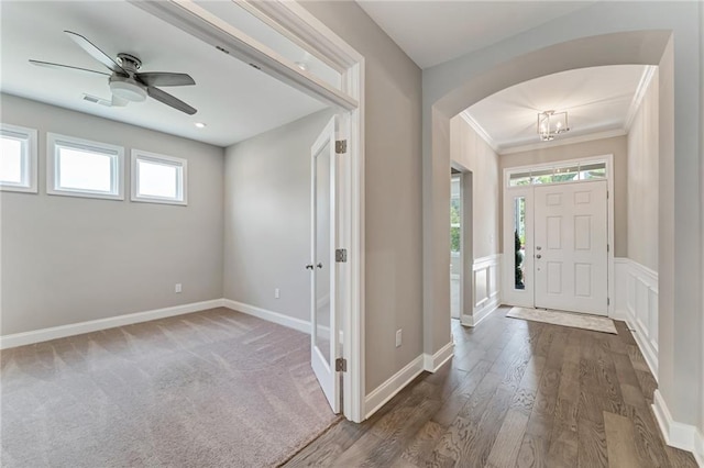 242 Aspen Way, Dallas, GA 30157 - entryway with arched walkways, healthy amount of natural light, a ceiling fan, wood finished floors, and crown molding