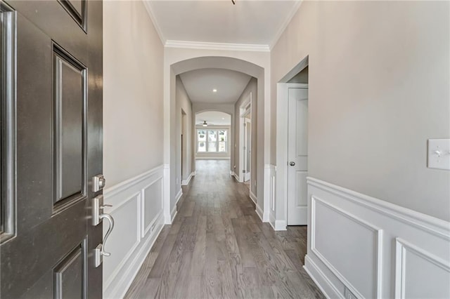 242 Aspen Way, Dallas, GA 30157 - foyer featuring arched walkways, wainscoting, wood finished floors, and crown molding