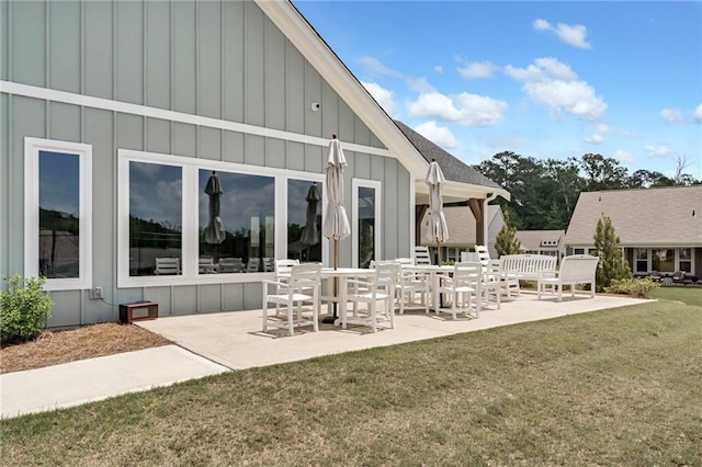 242 Aspen Way, Dallas, GA 30157 - rear view of property featuring board and batten siding, a patio area, and a yard