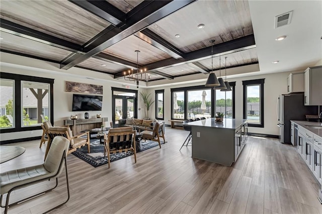 242 Aspen Way, Dallas, GA 30157 - living room with light wood-type flooring, beamed ceiling, coffered ceiling, and a chandelier