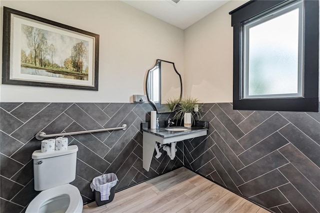 242 Aspen Way, Dallas, GA 30157 - half bath with tile walls, wainscoting, and wood finished floors