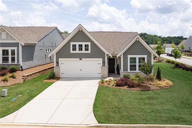 242 Aspen Way, Dallas, GA 30157 - view of front facade with stone siding, concrete driveway, a front lawn, and a shingled roof