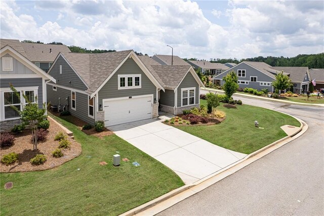 242 Aspen Way, Dallas, GA 30157 - view of front facade with driveway, an attached garage, a shingled roof, and a front lawn