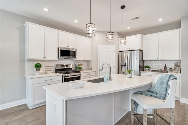 242 Aspen Way, Dallas, GA 30157 - kitchen featuring stainless steel appliances, decorative backsplash, white cabinets, and recessed lighting