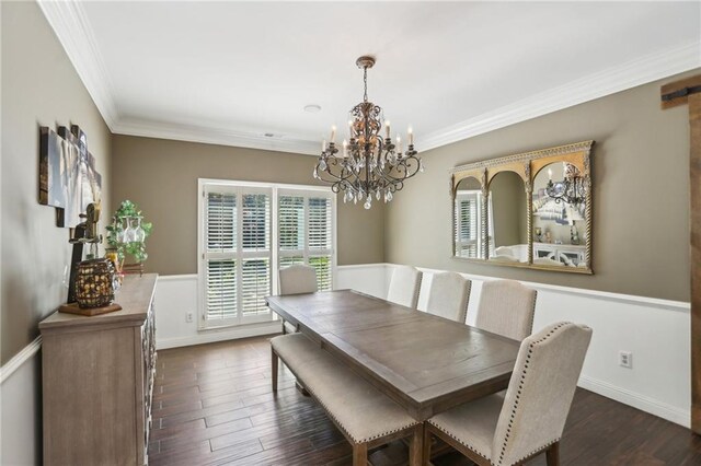 dining space featuring a chandelier, crown molding, dark wood-style floors, and baseboards