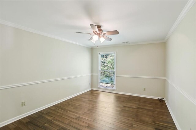 empty room with wood finished floors, a ceiling fan, baseboards, and ornamental molding