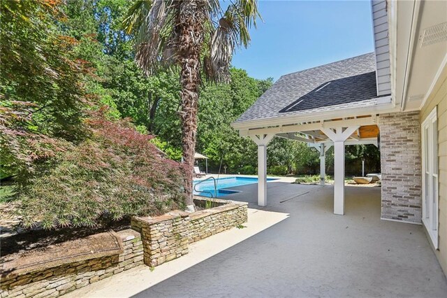 view of patio / terrace featuring an outdoor pool