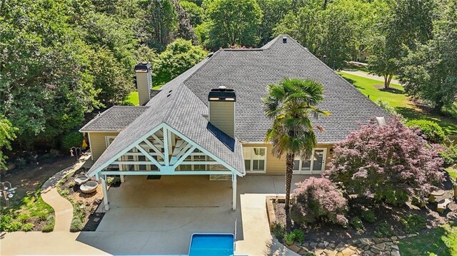 view from above of property with a forest