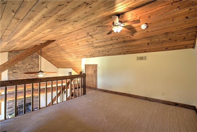 additional living space featuring a ceiling fan, visible vents, and baseboards