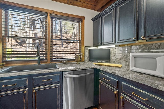 kitchen with sink, blue cabinets, beam ceiling, tasteful backsplash, and stainless steel dishwasher