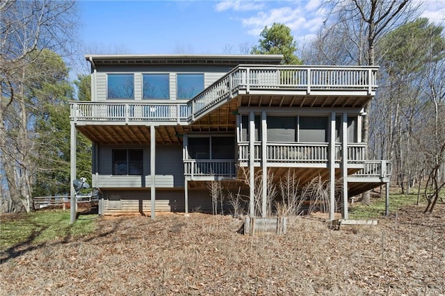 rear view of property with a wooden deck