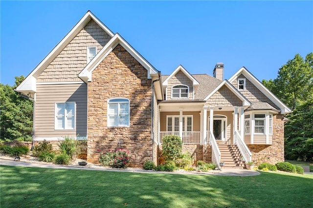 craftsman-style house featuring a front lawn and a porch