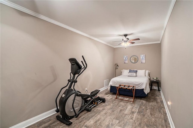 bedroom with ornamental molding, hardwood / wood-style floors, and ceiling fan