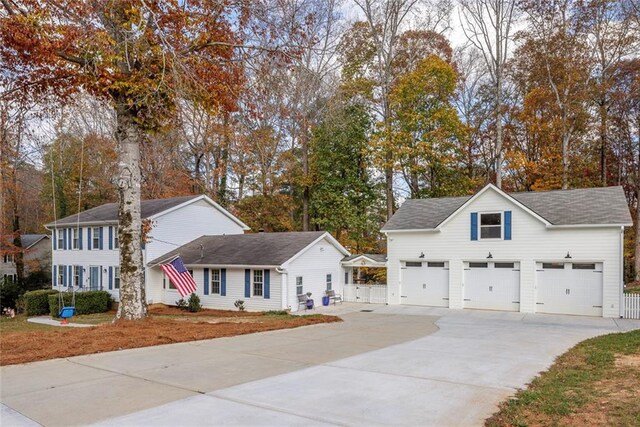 colonial-style house with a front lawn