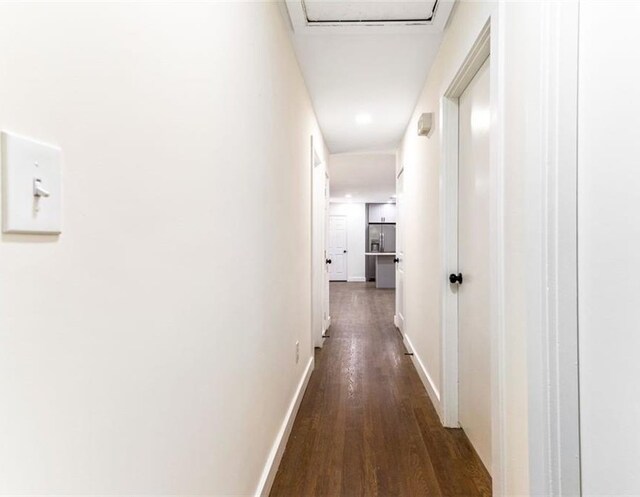 hallway featuring dark wood-type flooring